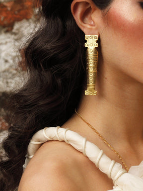 Statuesque mismatched earrings